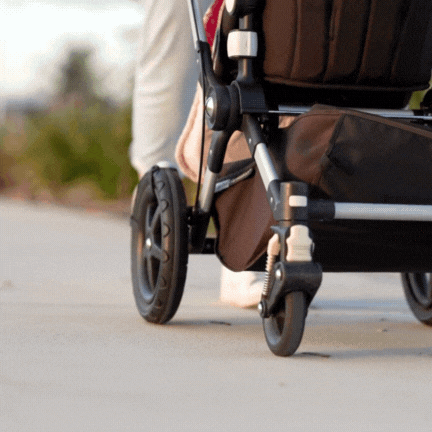 Pram accessory and baby sleep aid LullaBump on pram wheel in motion
